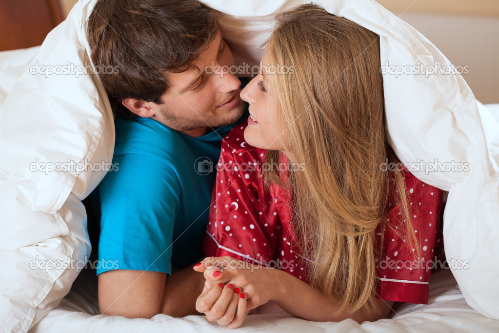 Couple under quilt