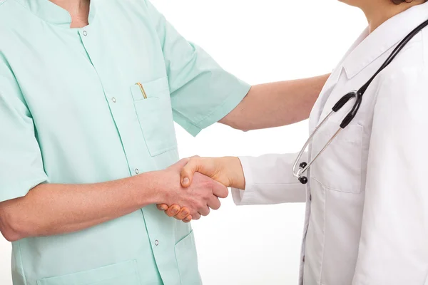 Рукопожатие врач и медсестра — стоковое фото