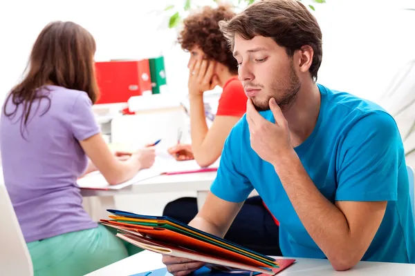 Students thinking about difficult exercise — Stock Photo, Image