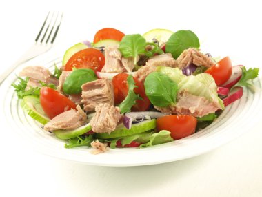 Salad with tuna, tomatoes, basil and onion. clipart