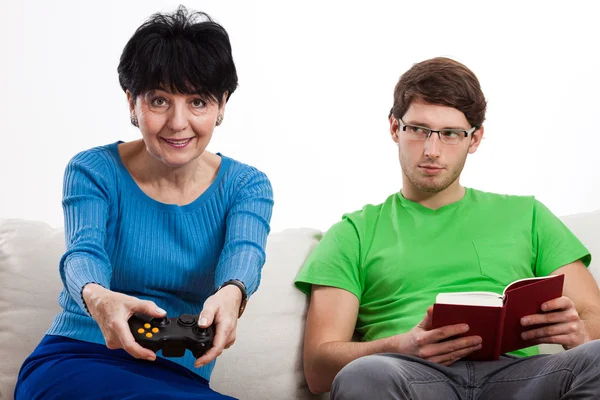 Elderly woman playing vdeo game — Stock Photo, Image