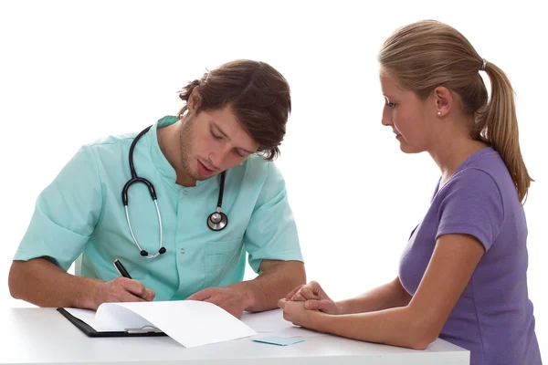 Doctor writing a prescription — Stock Photo, Image