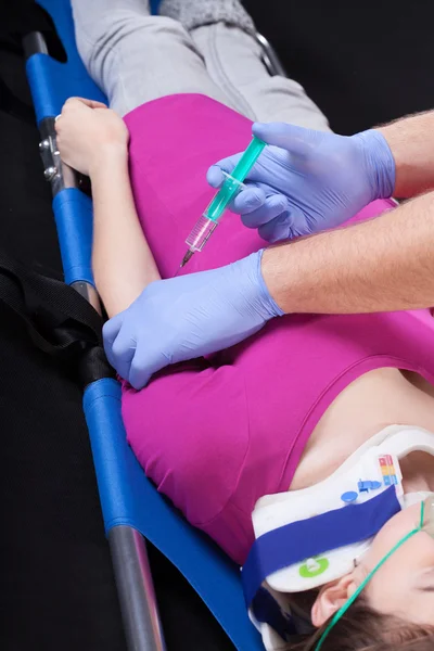 Injection on stretcher — Stockfoto