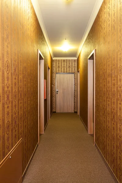 Long vintage hotel corridor — Stock Photo, Image