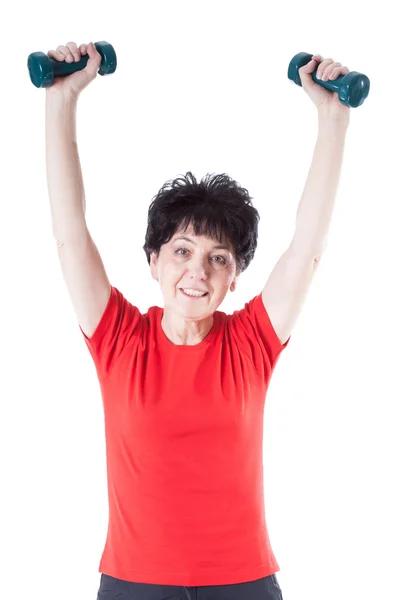 Elderly woman with weights — Stok fotoğraf