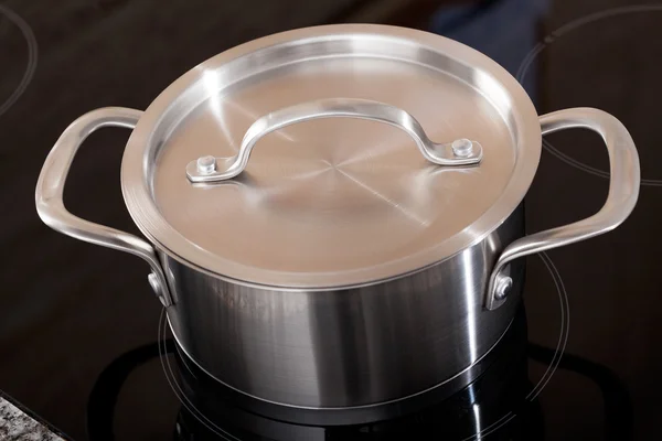 New clean aluminum pot in shot from above — Stock Photo, Image