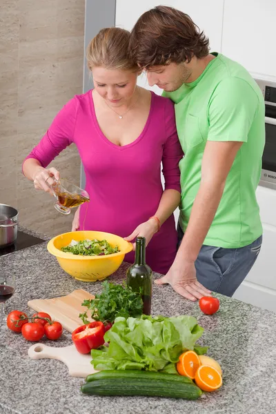 Making salad with olive oil — Stock Photo, Image