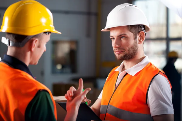 Consultoria de trabalhadores de armazém Imagem De Stock