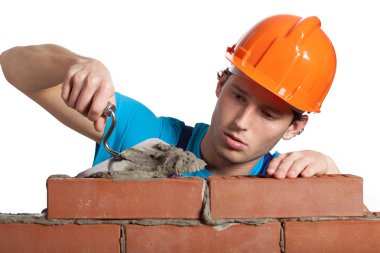 Concentrated bricklayer putting clipart