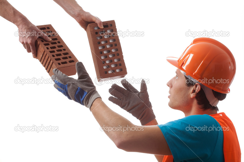 Builder taking bricks