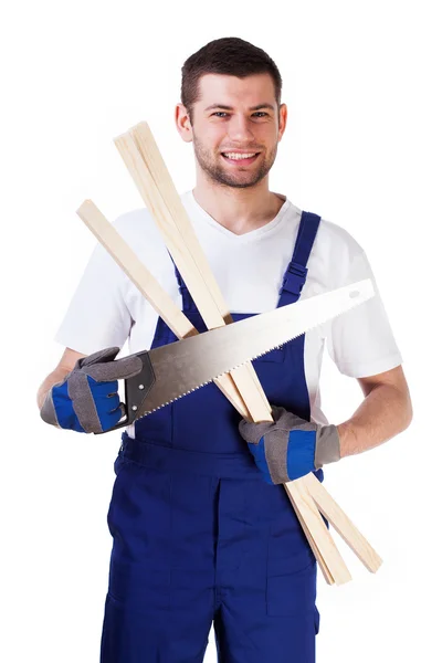 Homem com serra de mão e ripas — Fotografia de Stock