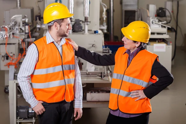 Employees at production area — Stock Photo, Image