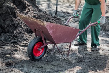 Worker transports a soil clipart