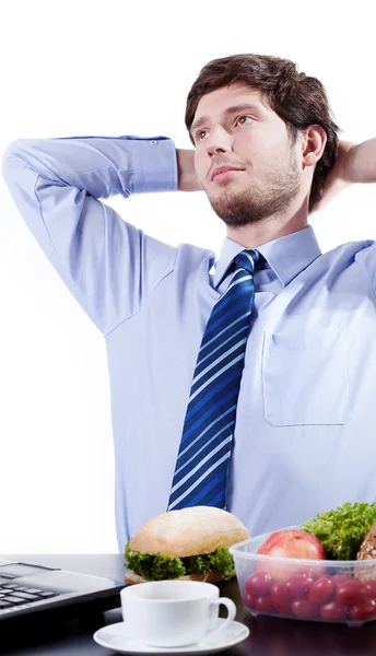 Businessman dreaming during lunch break — Stock Photo, Image