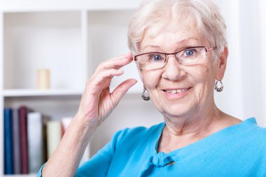 Grandmother wearing reading glasses clipart