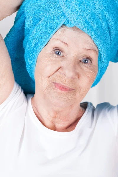 Elderly lady with towel — Stock Photo, Image