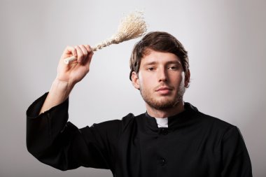 Priest with sprinkler clipart