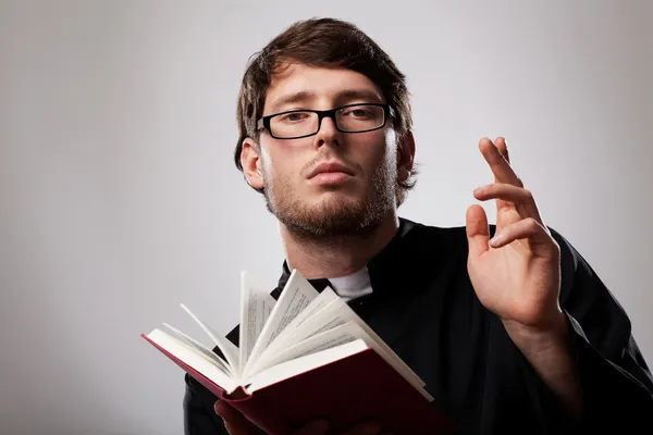Priest with Holy Bible — Stock Photo, Image