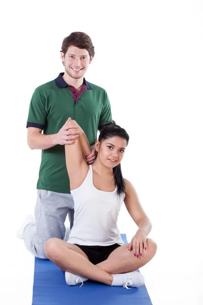 Stretching arms with trainer — Stock Photo, Image