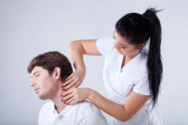 Massaging a neck — Stock Photo, Image