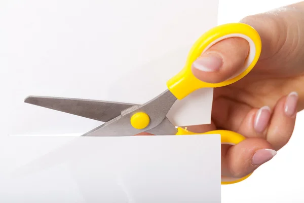 Scissors cutting paper — Stock Photo, Image