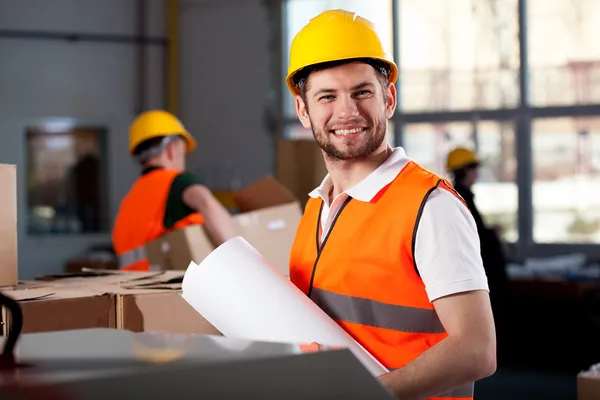 Smiling factory worker — Stock Photo, Image