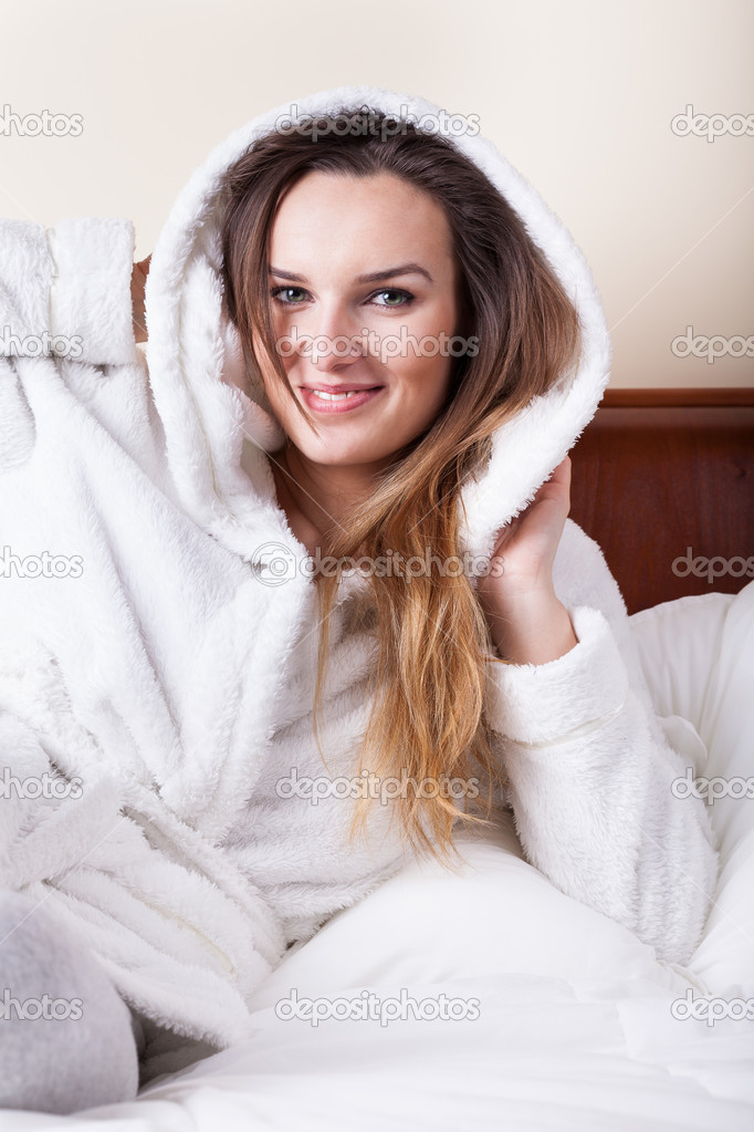 Woman in bathrobe before sleeping