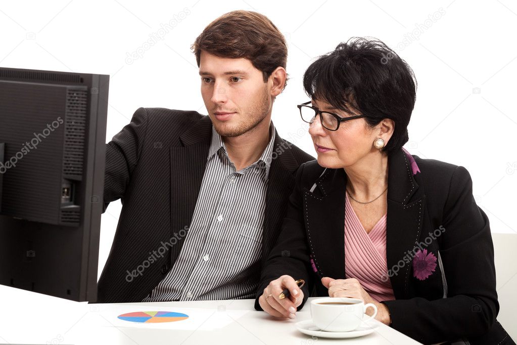 Coworkers analysing computer data