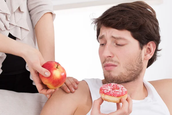 Man choosing junk food — Stock Photo, Image