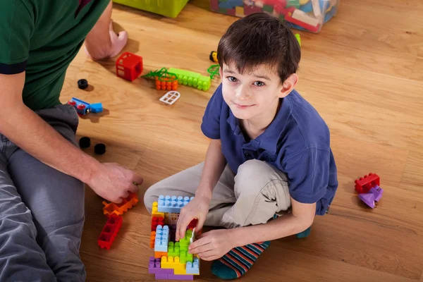 A boy with blocks on the floor — Stock Photo, Image