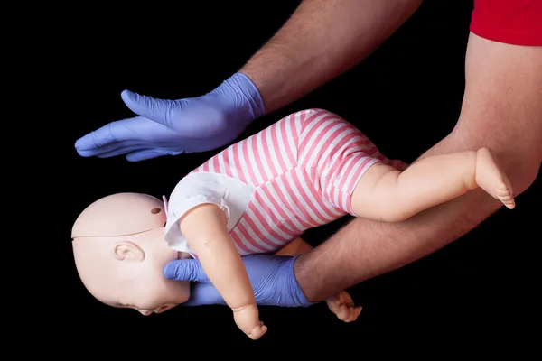 First aid for choking infant — Stock Photo, Image