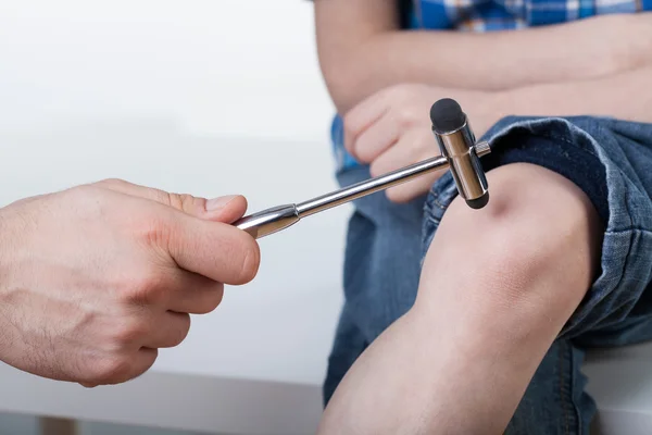 Orthopedist during examining a boy — Stock Photo, Image