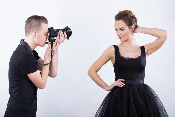 Man with camera taking a photo — Stock Photo, Image