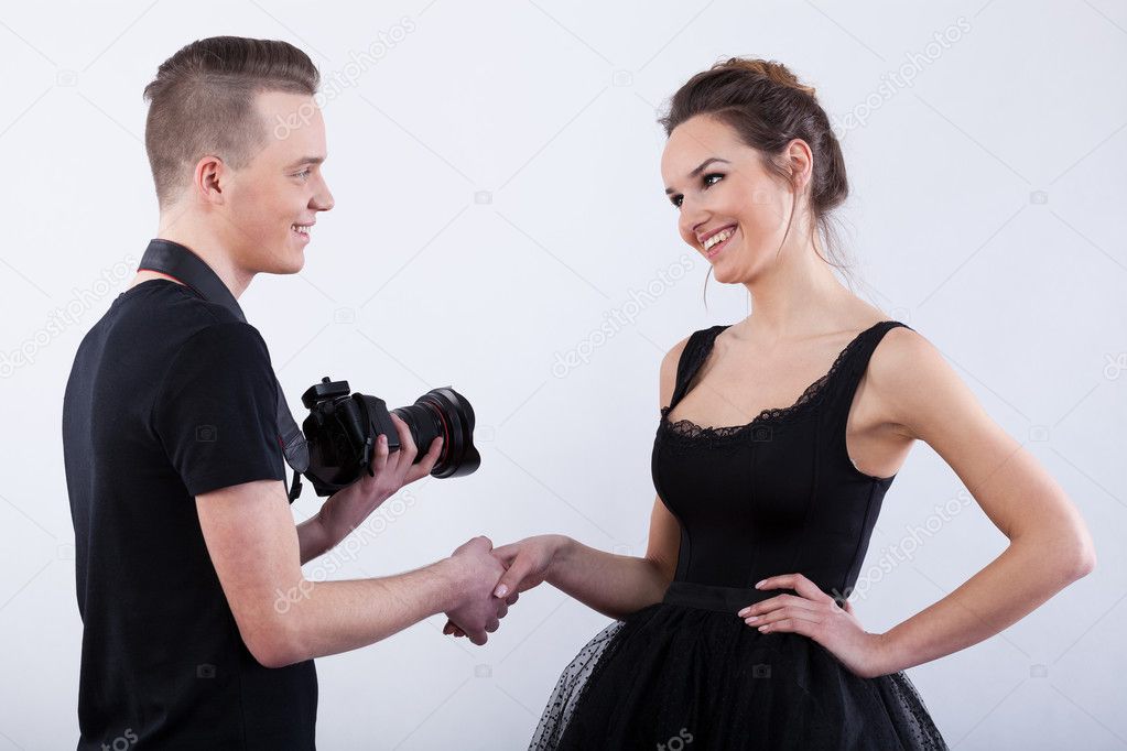 Photographer saying  to model