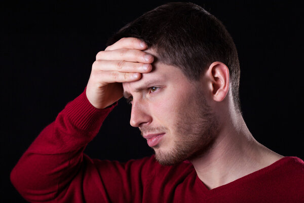 Man holding his head 