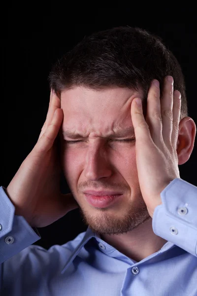 Man holding head in pain — Stock Photo, Image