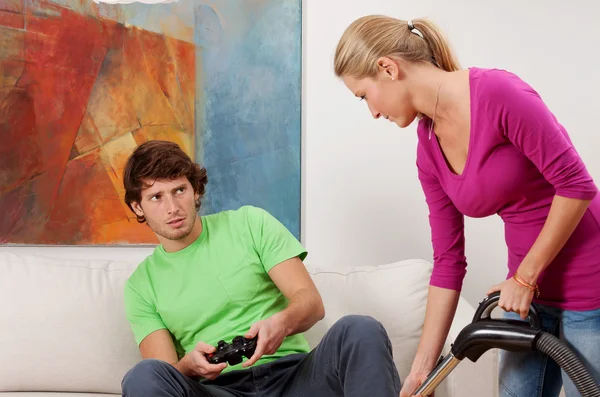 Vacuuming and video games — Stock Photo, Image