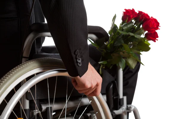 Disabled man with bouquet of flowers — Stock Photo, Image