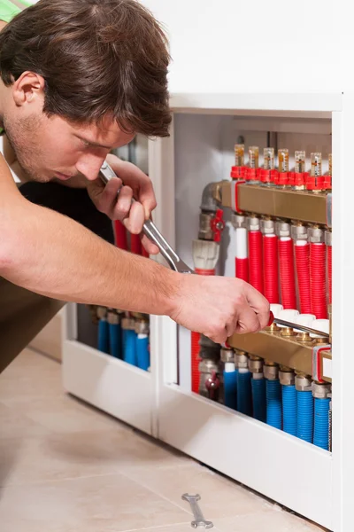 Handyman in boiler room — Stock Photo, Image