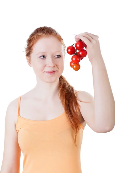 Woman with twig of tomatoes — Stock Photo, Image