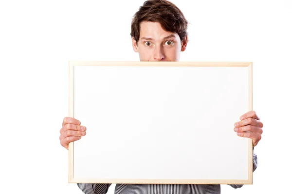 Homem feliz segurando placa branca em branco — Fotografia de Stock