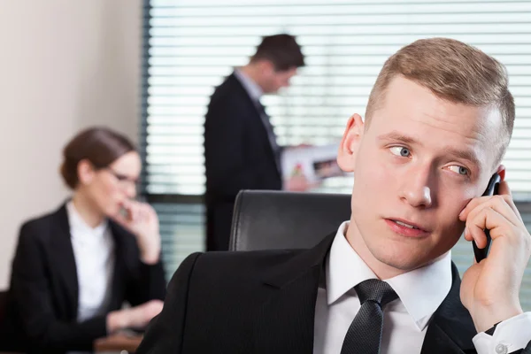 Co-workers during working in office Stock Photo