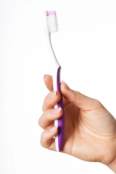 Hand holding toothbrush — Stock Photo, Image