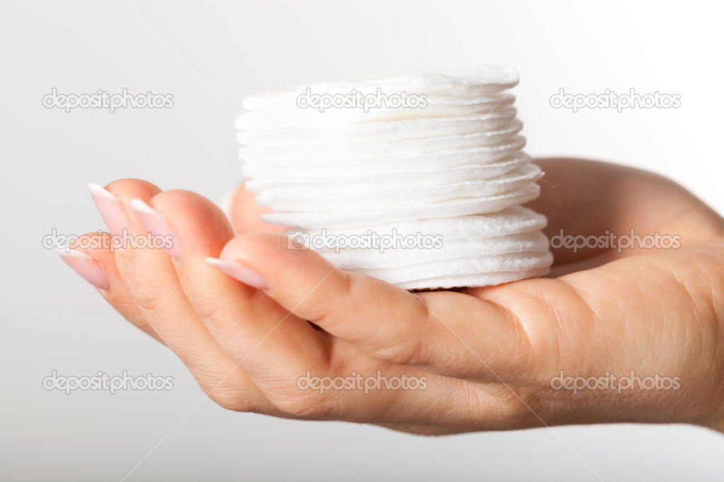 Hand with cotton pads