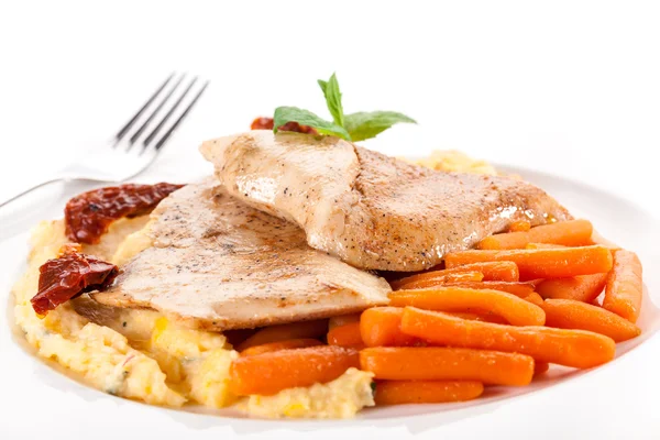 Grilled meat with small carrots — Stock Photo, Image