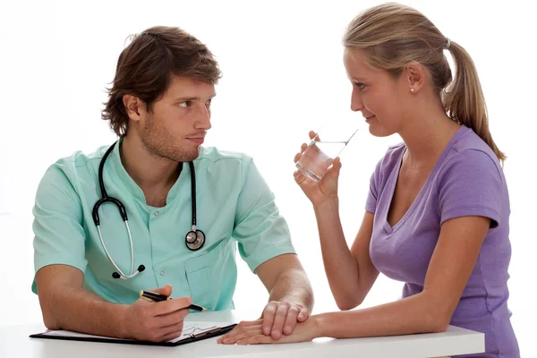 Doctor holding patient's hand — Stock Photo, Image