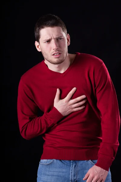 Man having chest pain — Stock Photo, Image