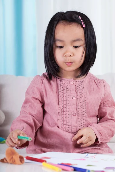 Girl with crayons — Stock Photo, Image