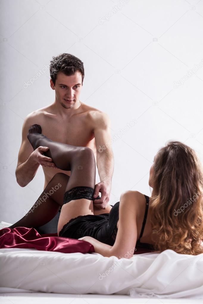 Man undressing his woman