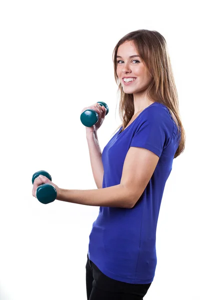 Side view of a woman lifting weights — Stock Photo, Image
